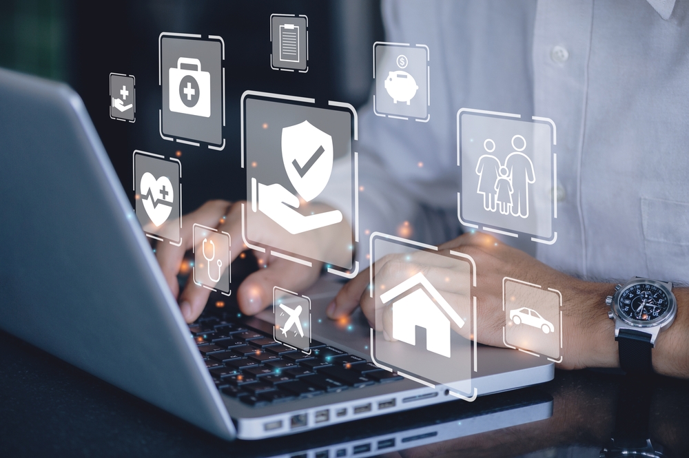 Businessman,Using,A,Computer,To,Insurance,Online,For,Car,,Travel,